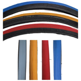 Close up view of the 24 x 1 in. (25-540) Primo V-Trak Wheelchair Tire showing yellow, blue, red, and gray tread